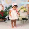 Vestido de bebé con estampado de patitos y bordado artesanal en nido de abeja
